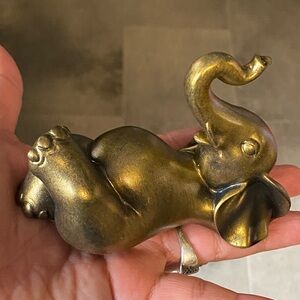 Gold Elephant laying relaxing Figurine